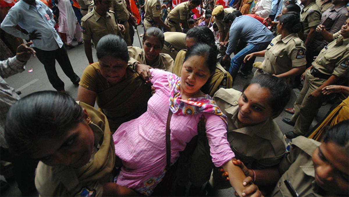Police forcibly removing an activist who was taking part in a dharna in front of the Hyderabad Collectorate on Tuesday in protest against the Chief Minister&rsquo;s alleged comments insulting the Left parties. Photo: N Shiva Kumar